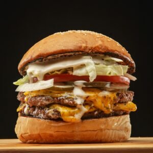 Close-up of a delicious double cheeseburger with toppings, perfect for fast food lovers.