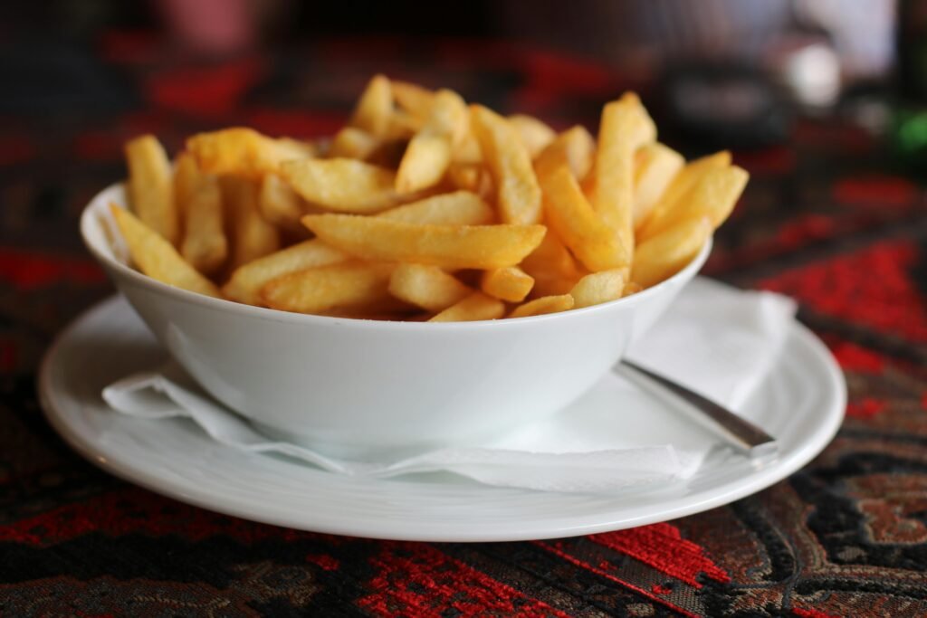 A tempting bowl of golden french fries, perfect for any meal or snack.